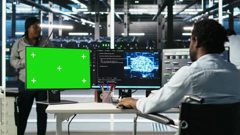 Data center worker with paraplegia using node trees on green screen PC Stock Footage 307329722