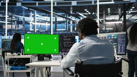 Data center worker with paraplegia using node trees on green screen PC Stockfoto's