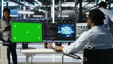 Data center worker with paraplegia using node trees on green screen PC Stockfoto's
