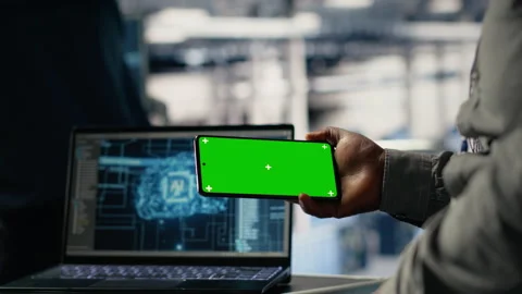 Data center worker uses green screen smartphone while deploying deep learning Stock Footage 314686184