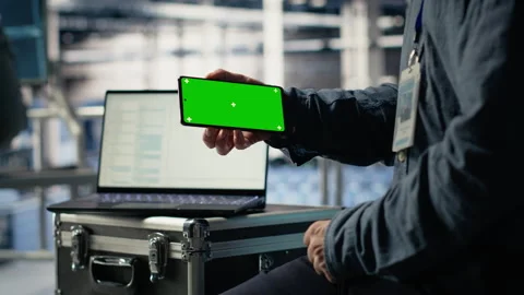 Data center worker uses isolated screen smartphone while deploying deep learning Stock Footage 314686081
