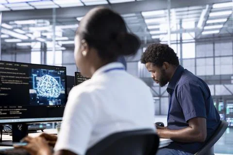 Data center worker using artificial intelligence parallel processing technology Stock Photos