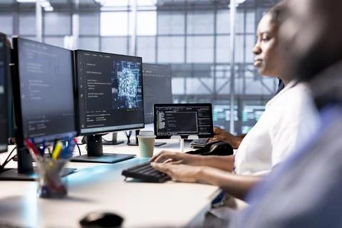 Data center worker using artificial intelligence computational models Stock Photos