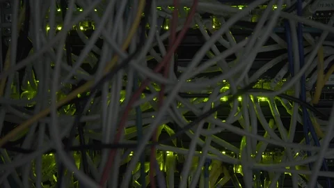 Data CenteSwitchboard panel with chaotic mess cables Flashing LED Lights At Dark Stock Footage