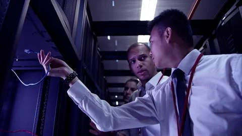 Data Centre with rows of servers and technicians Stock Footage 75343732