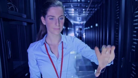 Data Centre with rows of servers and technicians Stock Footage 75343865