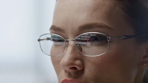 Data code reflecting glasses closeup. Software engineer woman programming work Stock Footage 242954379