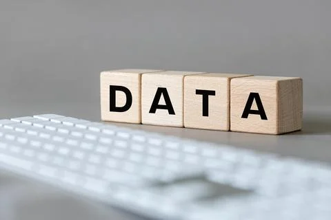 Data concept. The word DATA written on wooden cubes on a computer keyboard Stock Photos