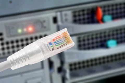 Data connection with rj45 patch cable, conceptual shot. Stock Photos