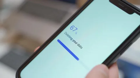 Data deletion progress bar stuck at 70 percent on smartphone screen 動画素材 343237914