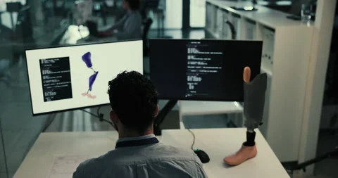 Data, development and person at computer screen with prosthetic leg, coding or Stock Footage 283590960
