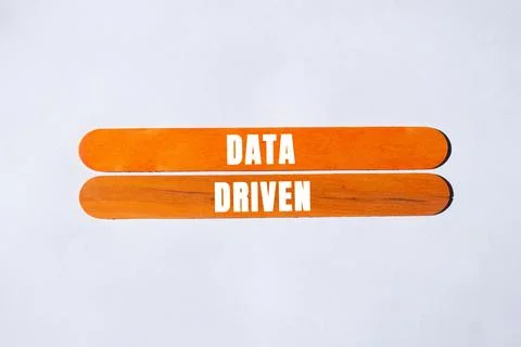 Data Driven message written on wooden stick background. Conceptual Data Dri.. Stock Photos