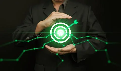 Data-driven target and growth concept with businessman holding glowing bull.. 스톡 사진