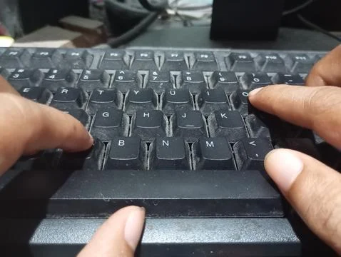 Data entry with hands typing on a keyboard. Working on the computer. Stock Photos