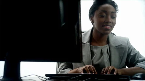 Data Entry Happy Dolly: African Female (1080p / 23.98) Stockbeeldmateriaal 2453197
