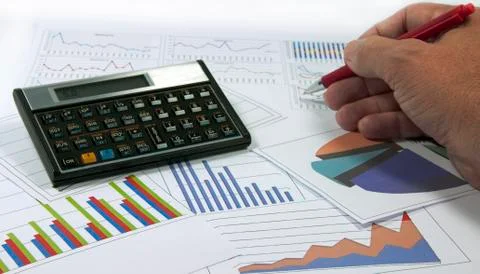 Data graphics analysis with calculator Stock Photos