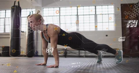 Data graphics flickering woman performing push-up cycles tracking fitness using 動画素材 312038339