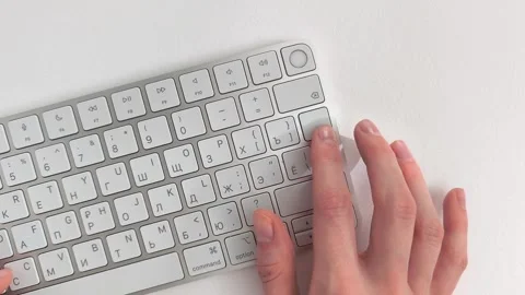 Data input processing with hands typing and hitting Enter key on a keyboard.. Stock Footage 346160836