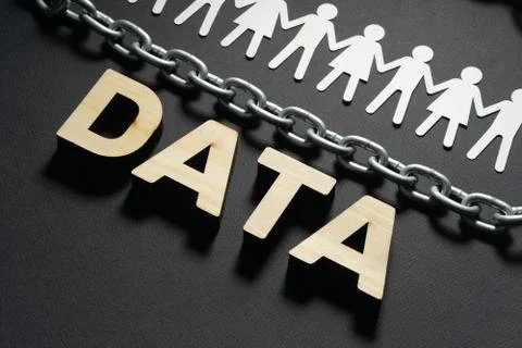 DATA letters in front of human paper figures and metal chain on black background Stock Photos