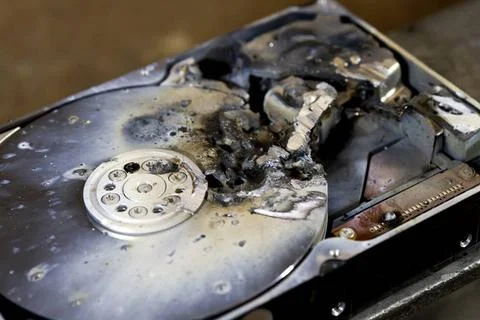 Data loss detail shot of a massive destroyed hard disk drive Copyright: xZ... Stock Photos