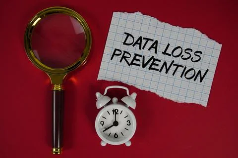 Data Loss Prevention text written on paper with magnifying glass and alarm .. 스톡 사진