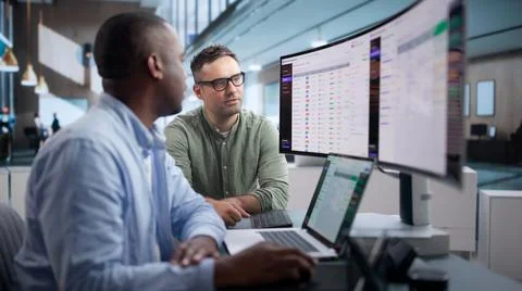 Data Manager Reviews Metadata Governance Dashboard Using Laptop For Enterpris Stock Photos