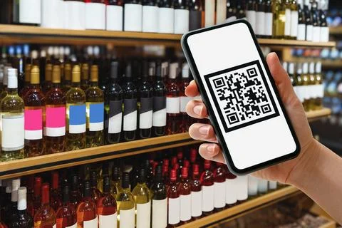 Data matrix qr code on screen of cell phone. Consumer scanning data code on w Stock Photos