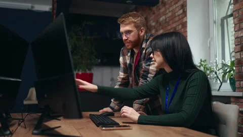 Data mining and machine learning department, two programmers discussing, man and Stock Footage 233735216