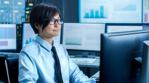 In the Data Mining Center Statistician sits at His Workstation Surrounded wit 写真素材