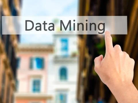 Data Mining - Hand pressing a button on blurred background concept on visual  写真素材