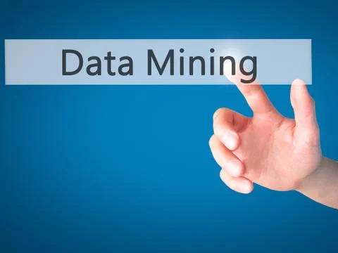 Data Mining - Hand pressing a button on blurred background concept on visual  Foto stock