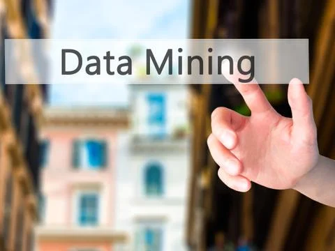 Data Mining - Hand pressing a button on blurred background concept on visual  스톡 사진
