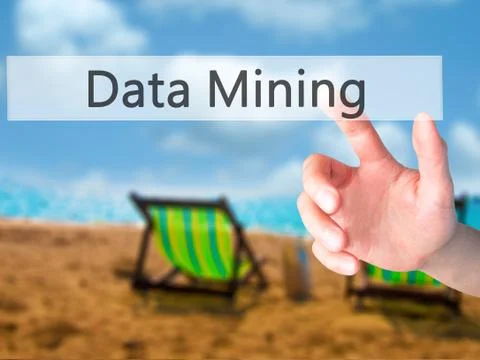 Data Mining - Hand pressing a button on blurred background concept on visual  Stock Photos