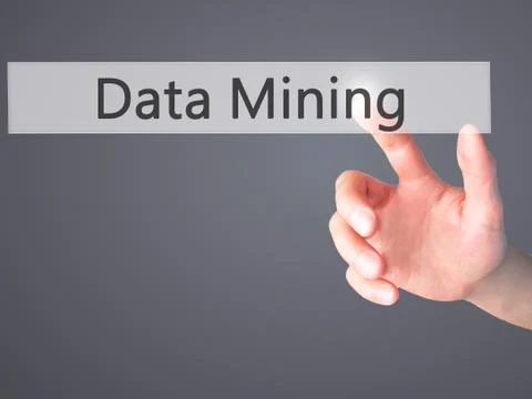 Data Mining - Hand pressing a button on blurred background concept on visual  Stock Photos