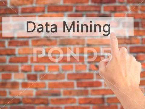 Data Mining - Hand pressing a button on blurred background conce Stock Photos