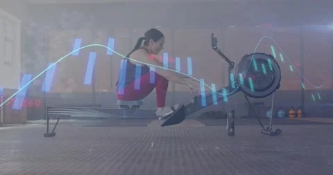 Data overlay appearing, woman rowing, adjusting foot straps and tracking Stock Footage 331614211