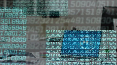 Data overlay fading in, scrolling and shifting over desk, laptop cycling blue Stock Footage 335638753
