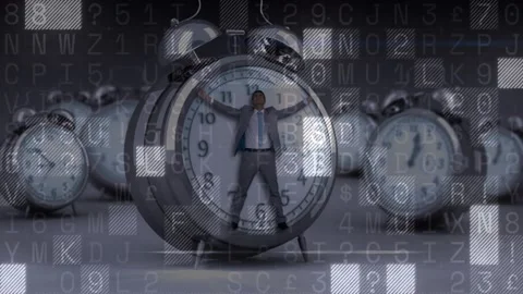Data overlay starting grid motion, businessman standing inside alarm clock, Stock Footage 329115717