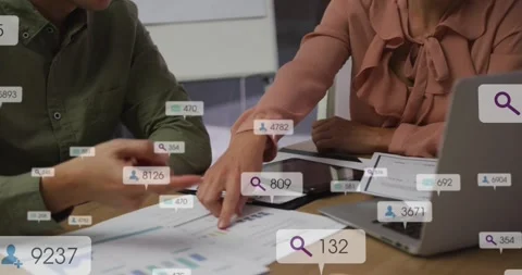 Data overlays appearing, analyst pointing charts and manager checking tablet, Stock Footage 330237301