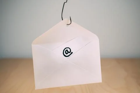 Data phishing. Data in an envelope on a fish hook. Stock Photos