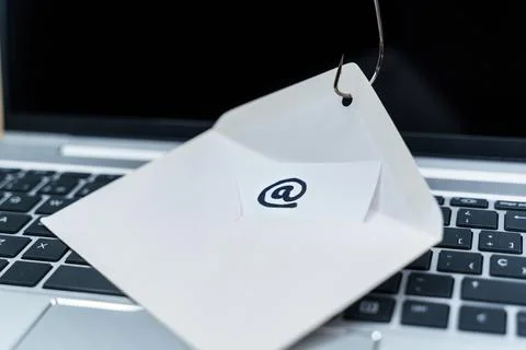 Data phishing. Data in an envelope on a fish hook. Stock Photos