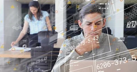 Data pinging overlays analyst scrolling laptop while assistant sorting papers Stock Photos