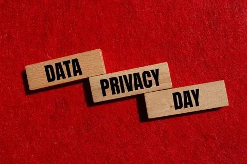 Data privacy day message written on wooden blocks with red background. Conc.. Stock Photos