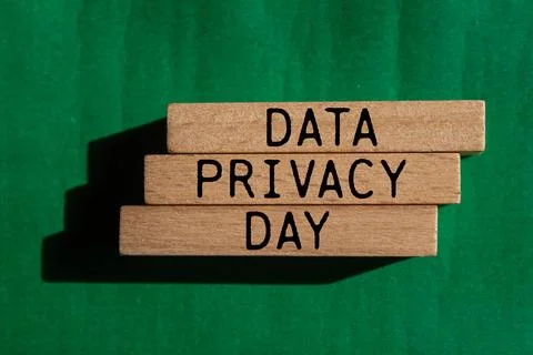 Data privacy day message written on wooden blocks with green background. Co.. Stock Photos