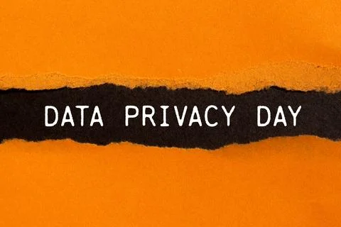 Data privacy day message written on ripped torn orange paper with black bac.. Stock Photos