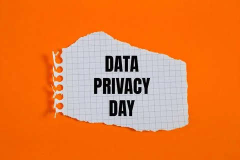 Data privacy day message written on ripped torn checkered graph paper piece.. Stock Photos