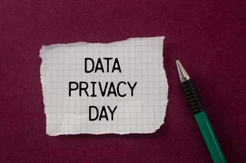 Data privacy day message written on ripped torn paper piece with purple bac.. Stock Photos