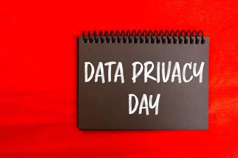 Data privacy day message written on black notebook page with red background.. Stock Photos