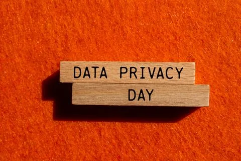 Data privacy day message written on wooden blocks with orange background. C.. Stock Photos
