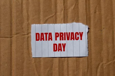 Data privacy day message written on ripped torn paper piece with cardboard .. Stock Photos